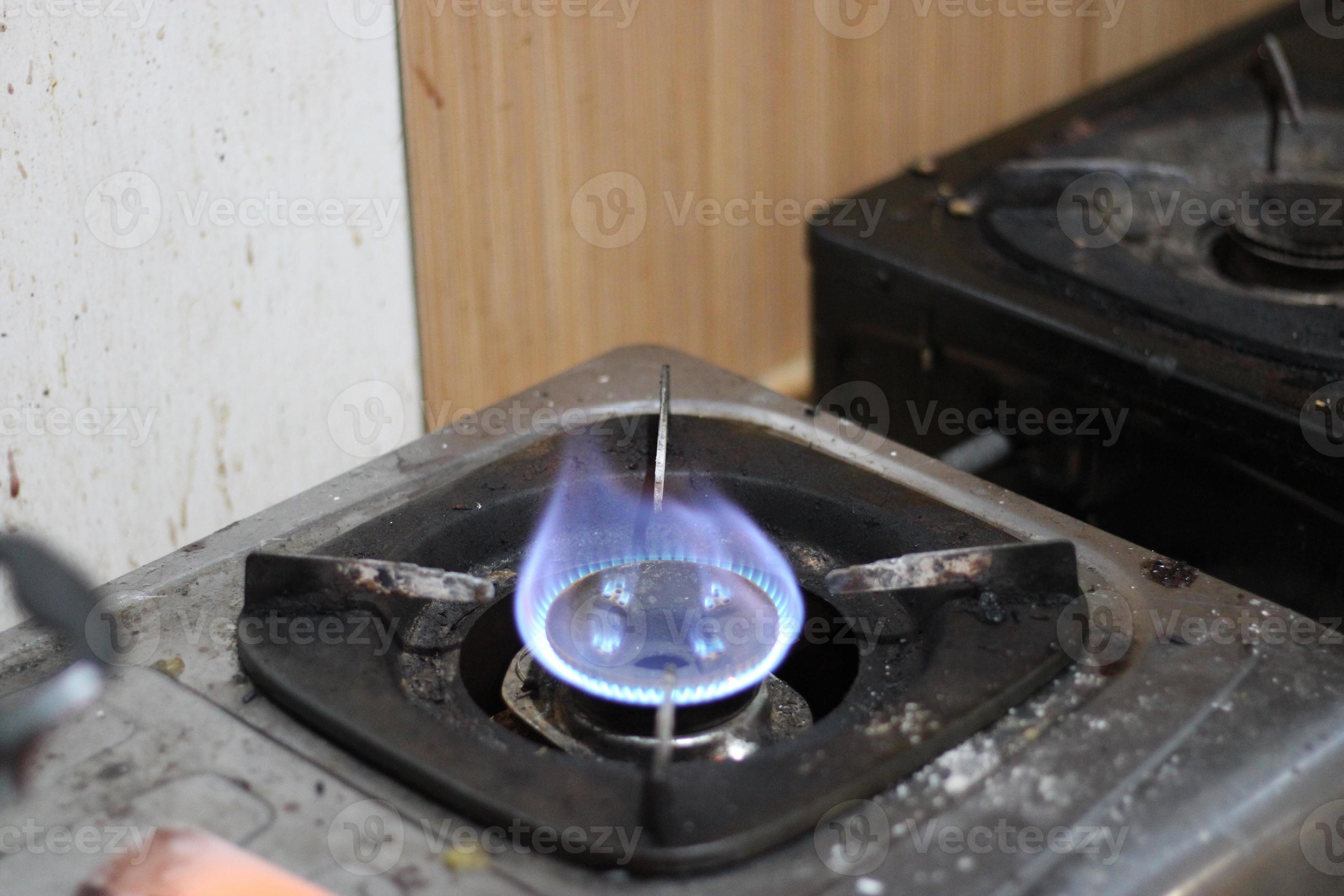 photo of gas stove lighting blue flame 22963025 Stock Photo at Vecteezy
