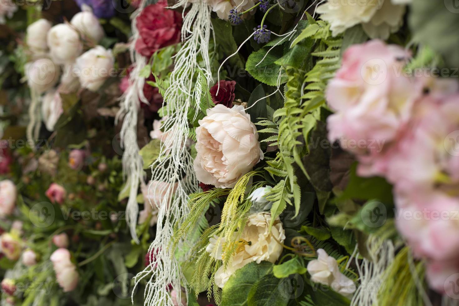 Texture flowers. Background of artificial flowers. Wall of inflorescences in detail. photo