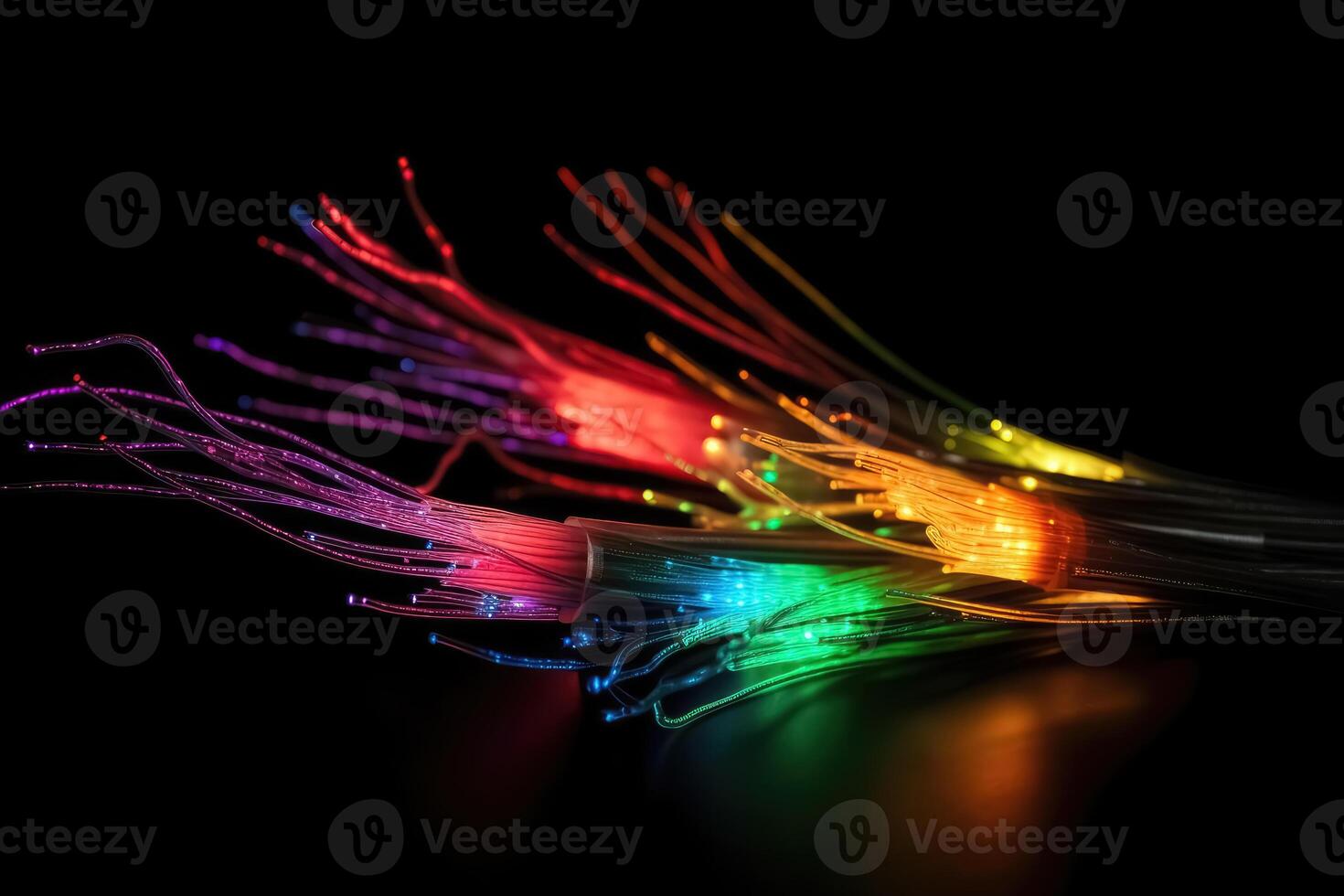 Some fibre optic cables glowing at the end in different colors against a black background created with technology. photo