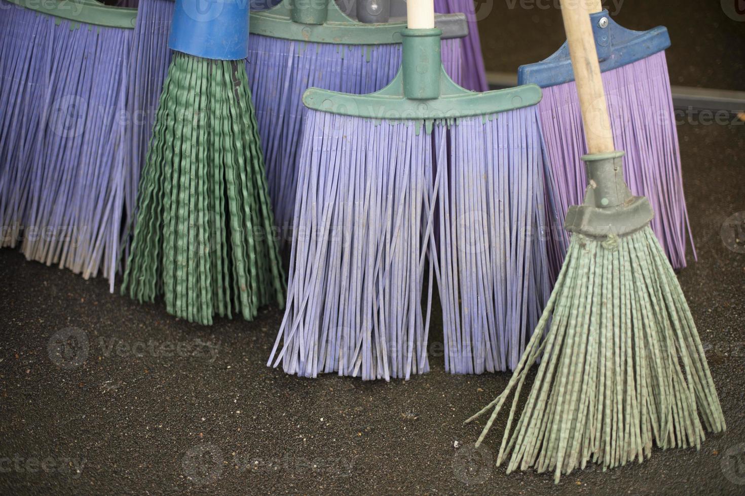 Broom for cleaning. Garden tools for leaf harvesting. Cleaning brushes. photo