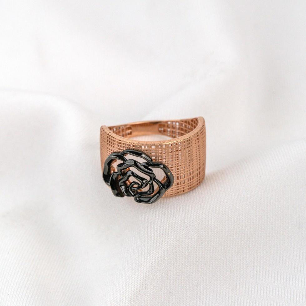 gold ring with black flower photo