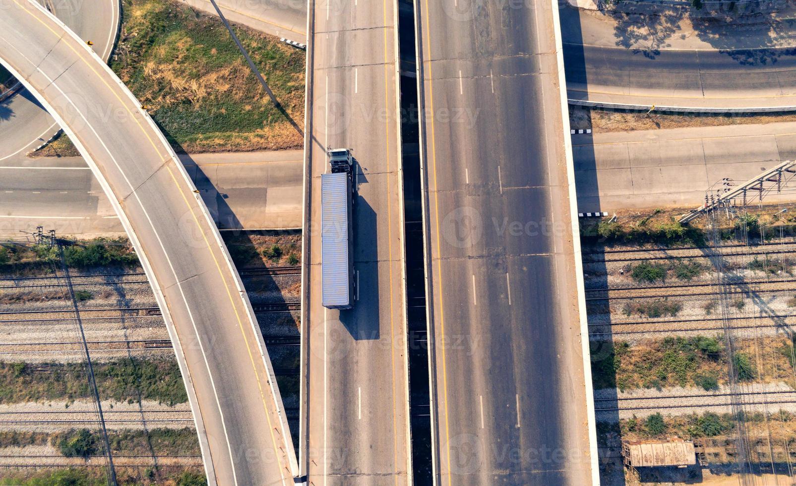 Aerial view of cargo Truck on highway road with blue container, transportation concept.,import,export logistic industrial Transporting Land transport on the asphalt expressway photo
