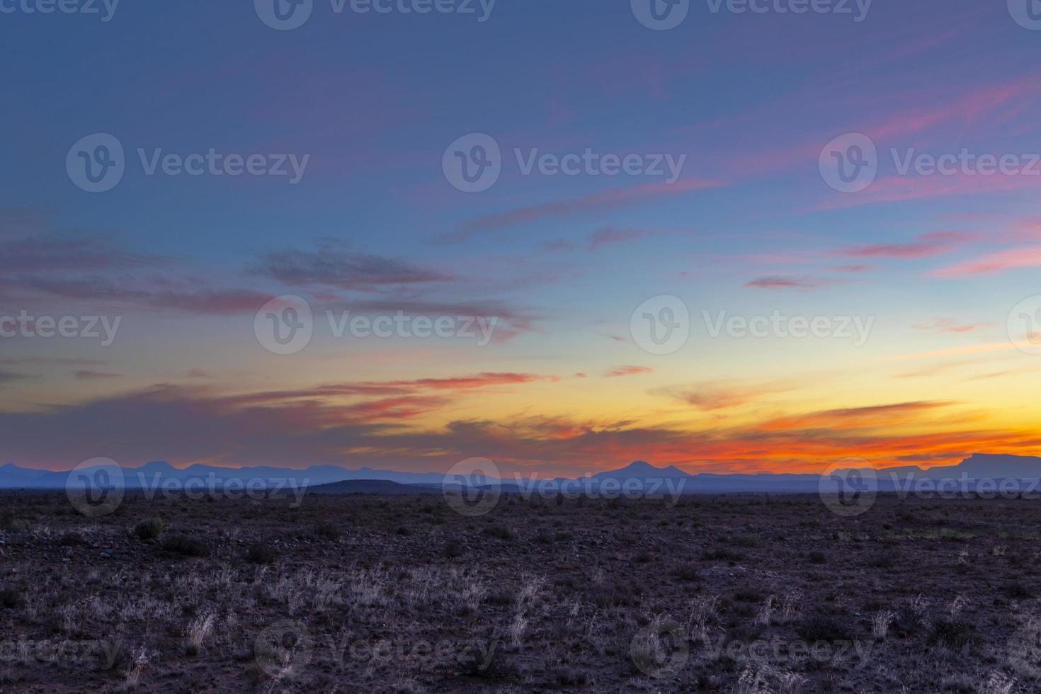 Orange red and pink clouds after sunset photo