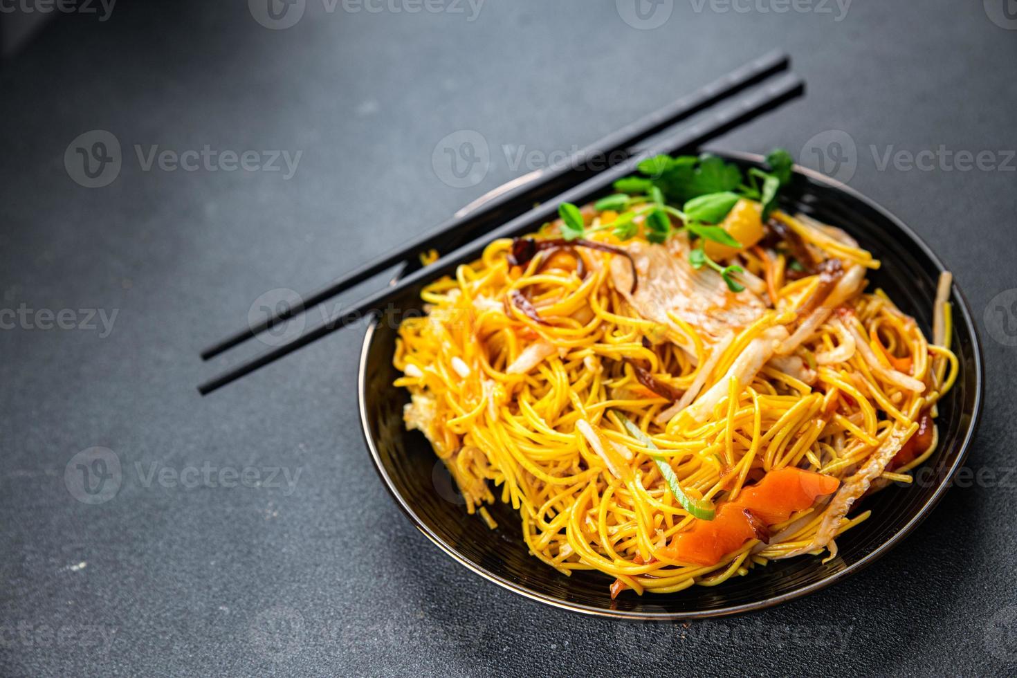 noodles chicken meat, vegetable meal food snack on the table copy space food background rustic top view photo