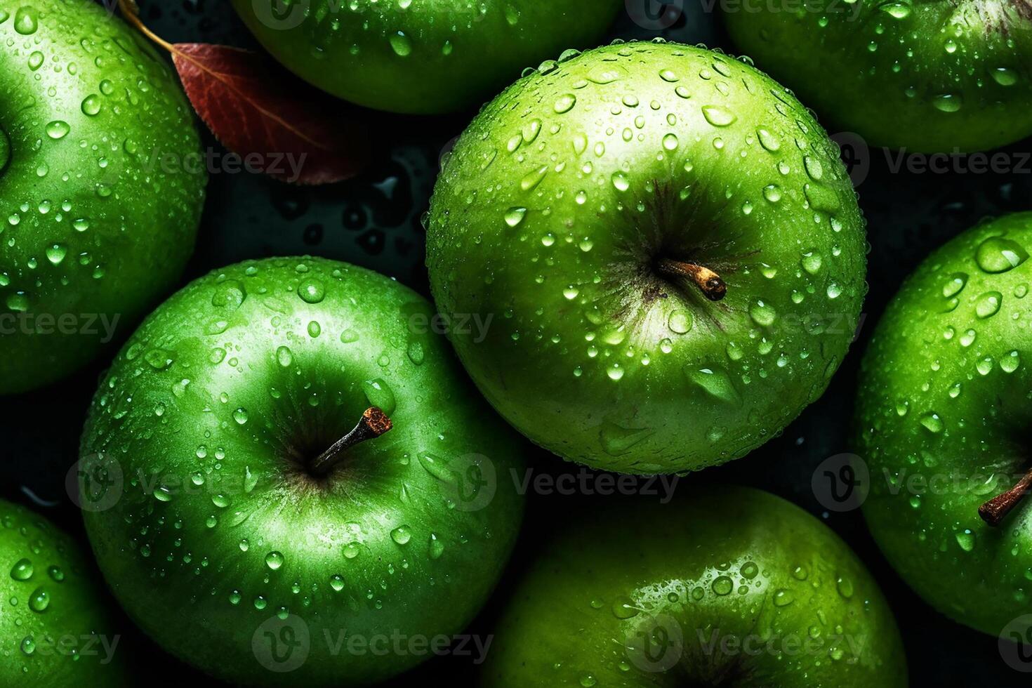 A green apple covered in water droplets. Apple background. photo