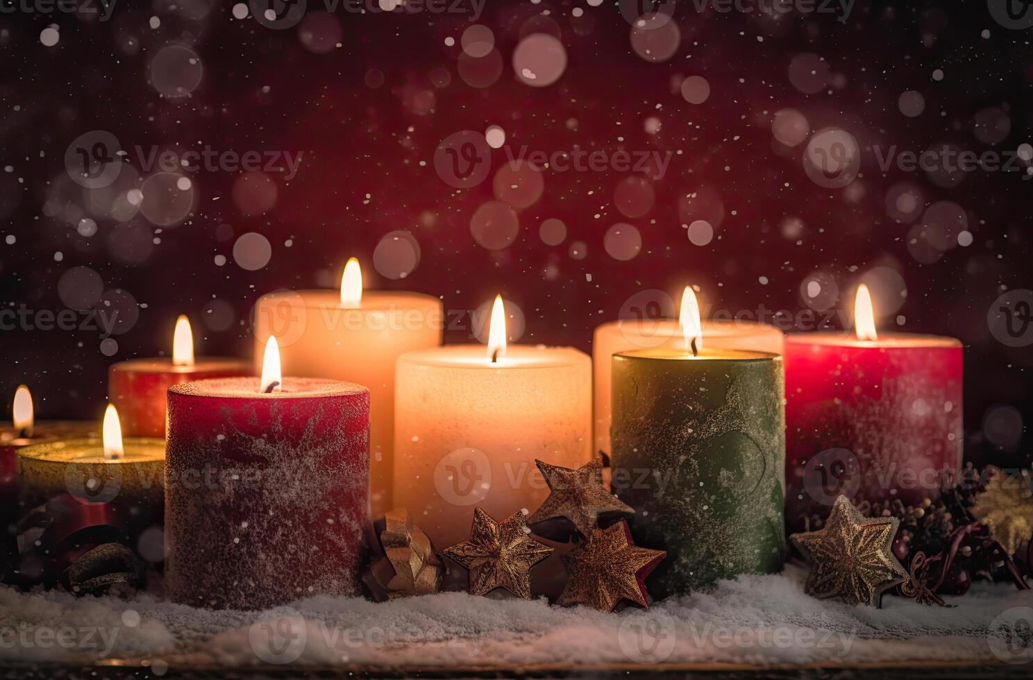 Burning candle and Christmas decoration over snow and wooden background. . photo