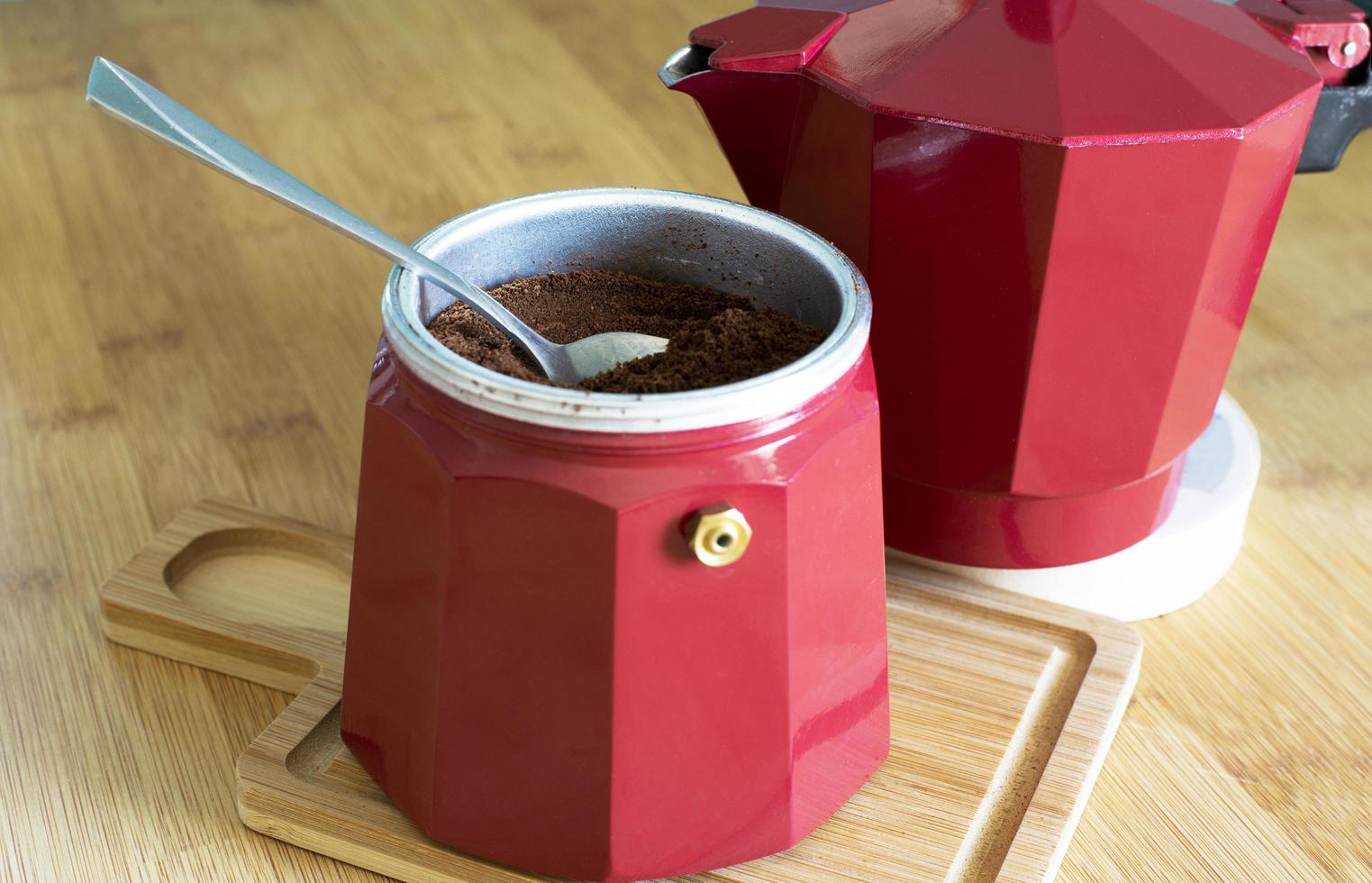 Red geyser coffee maker. Delicious and aromatic coffee. photo