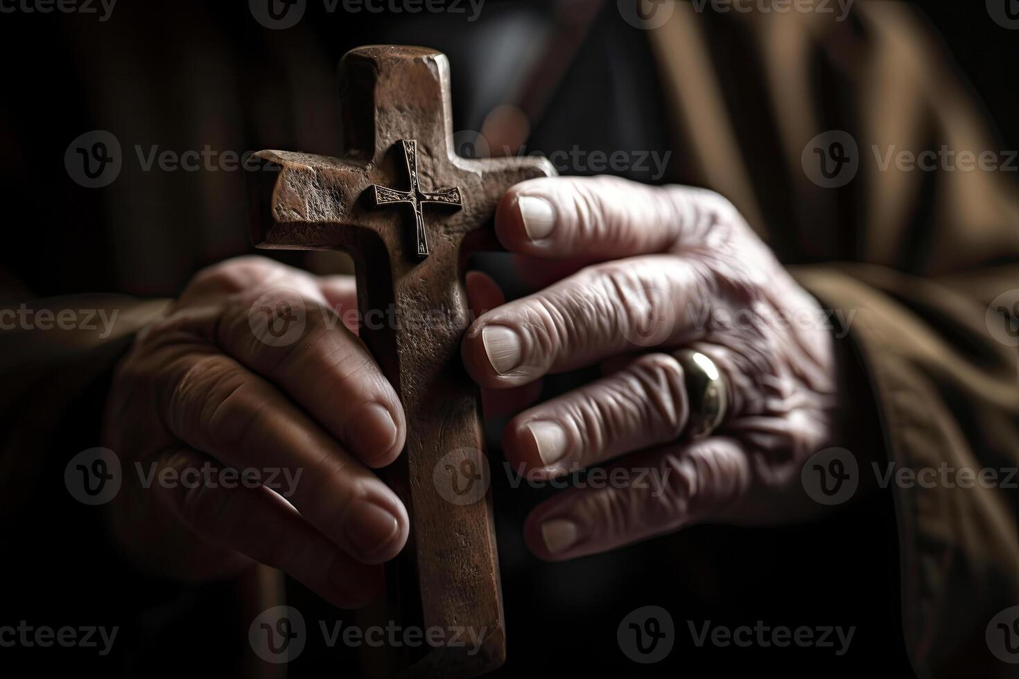 Church priest holds religious cross in hands. photo