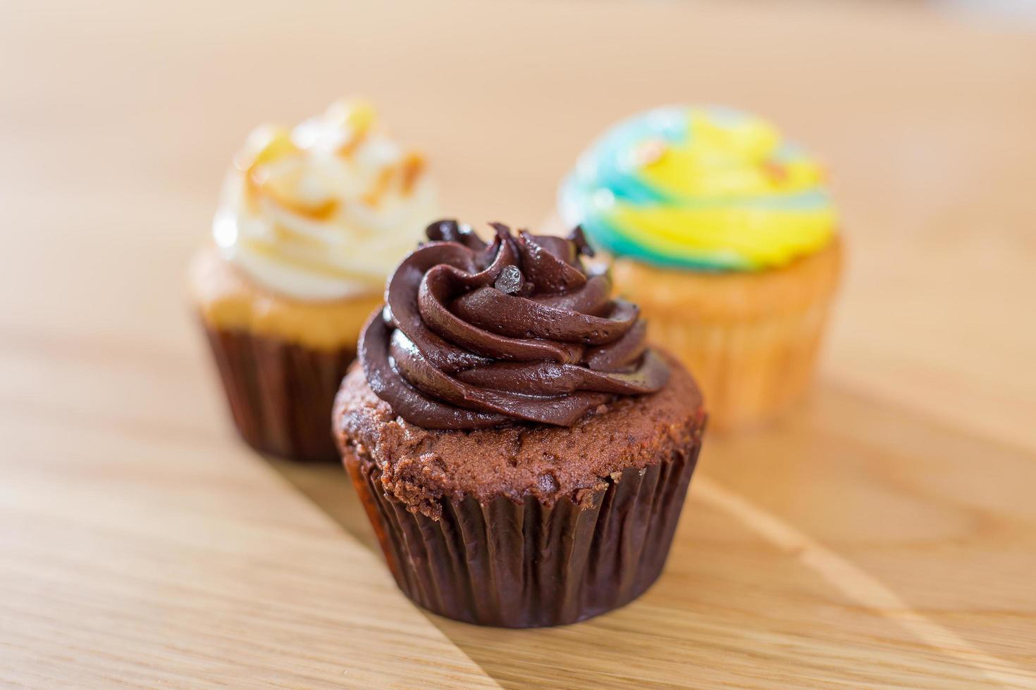 Cupcake on a wooden floor. photo