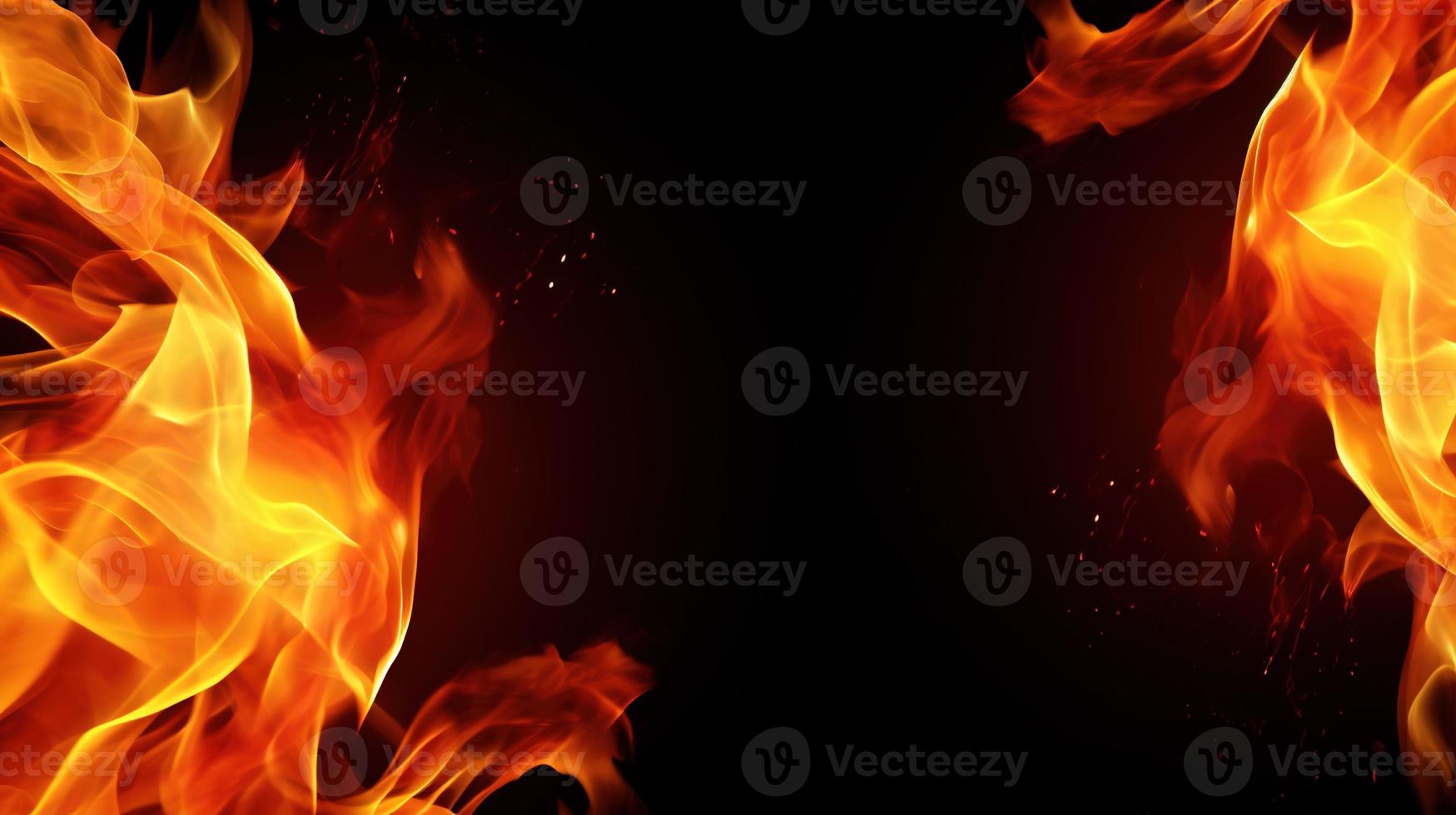 Fire flames on black background. Closeup of fire flames isolated on black background. photo