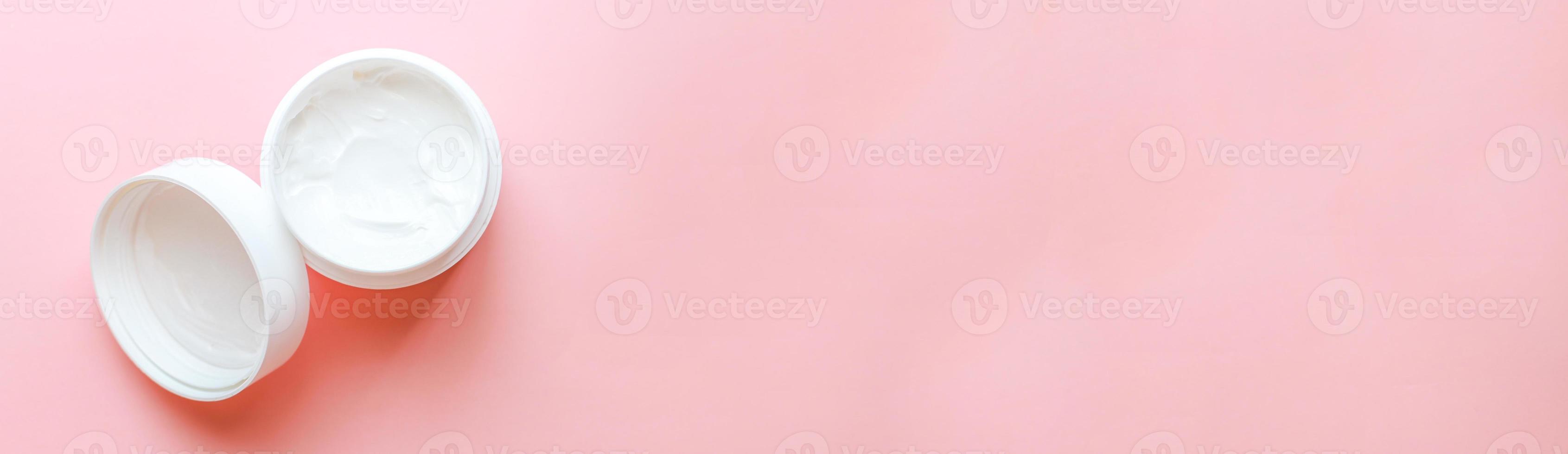 Banner Top view laying out hand cream on pink background photo