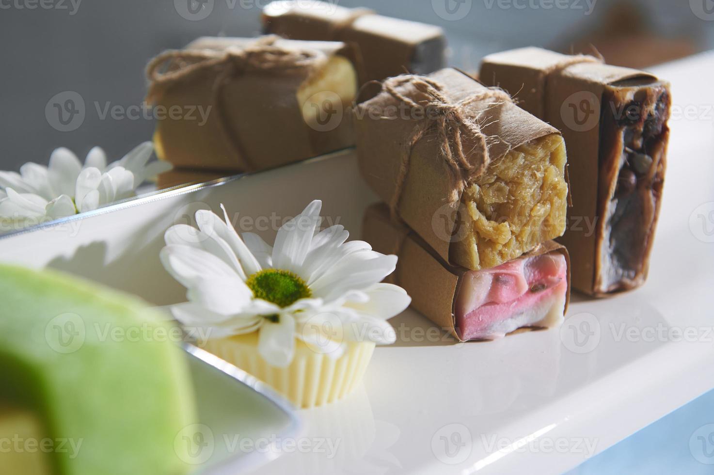 Still life organic soap bars, dry solid shampoo and hair conditioner with natural ingredients on a white background photo