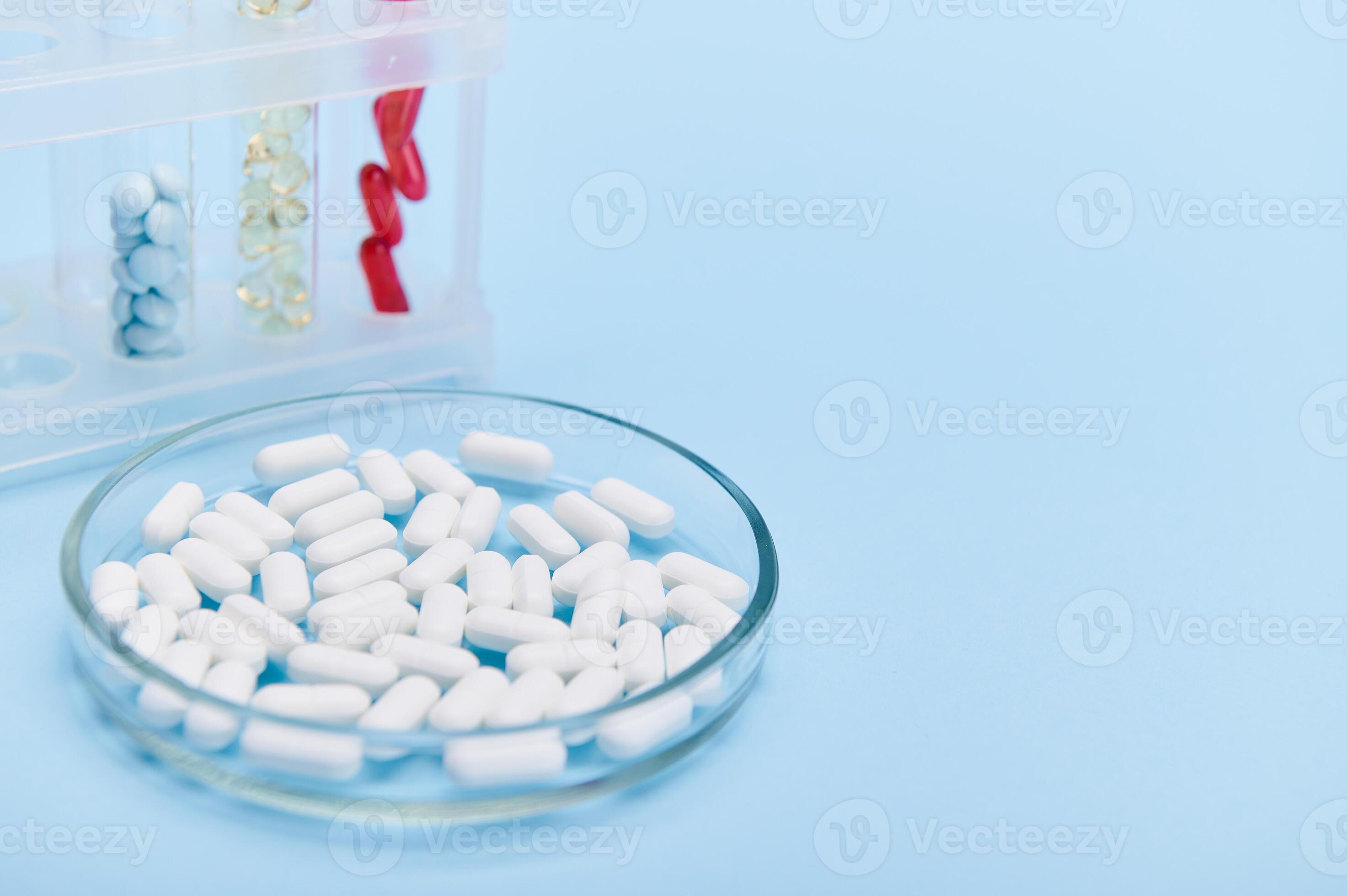 Selective focus on a petri dish with medical gelatin capsules on