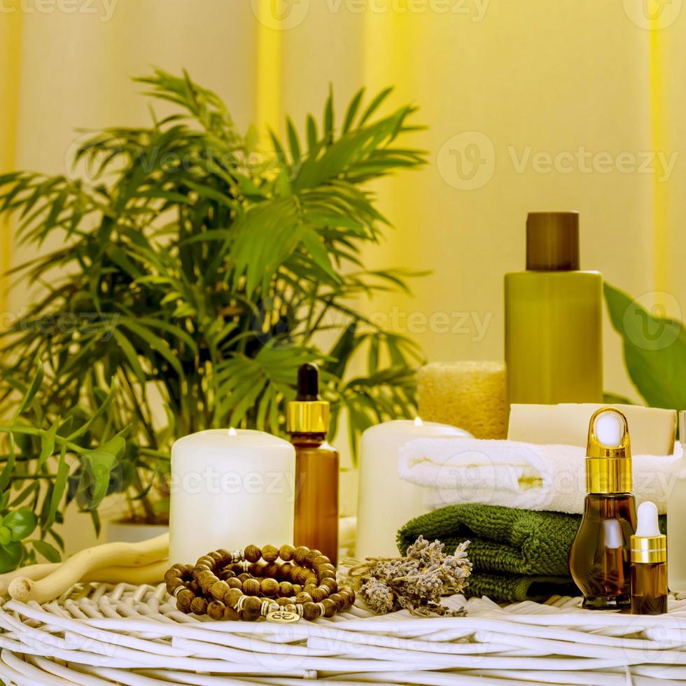 Natural beauty products, spa accessories, towels and candles in home interior photo