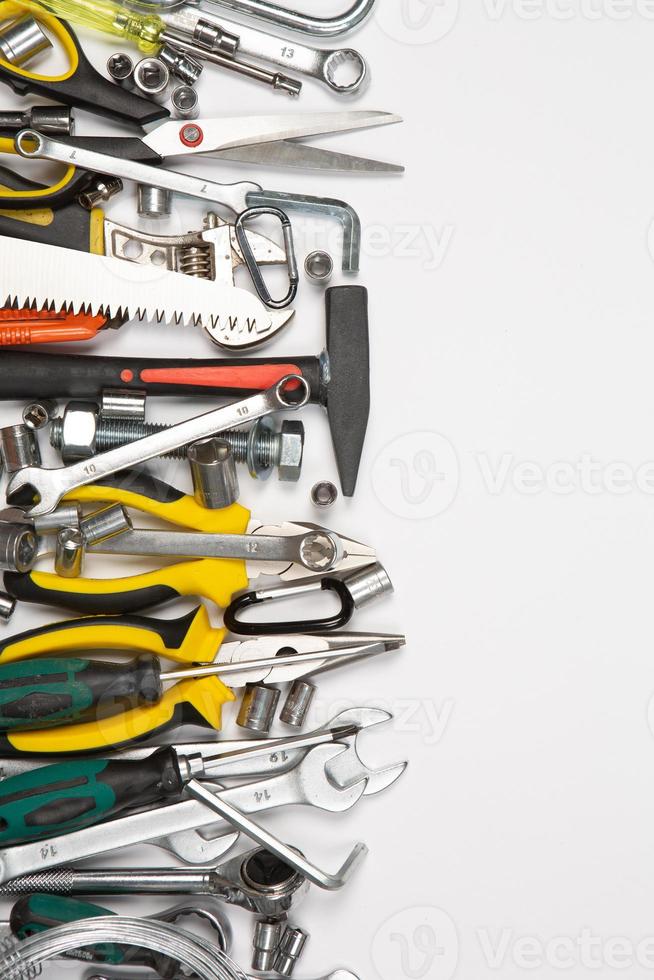 Set of tools for repair in a case on a white background. Assorted work or construction tools. Wrenches, Pliers, screwdriver. Top view photo