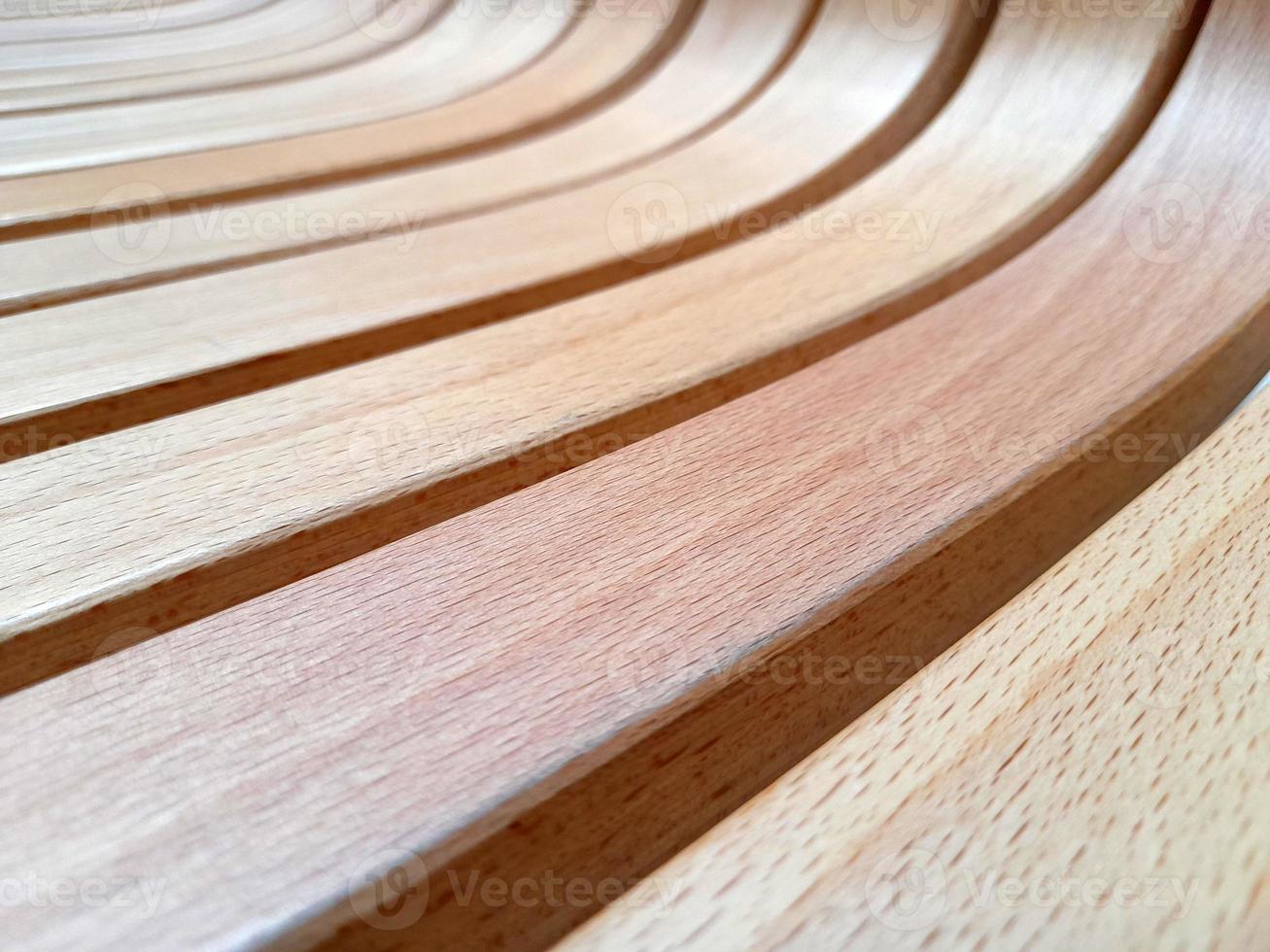 Curved wooden slats. Curved beams of light wood. creative wood