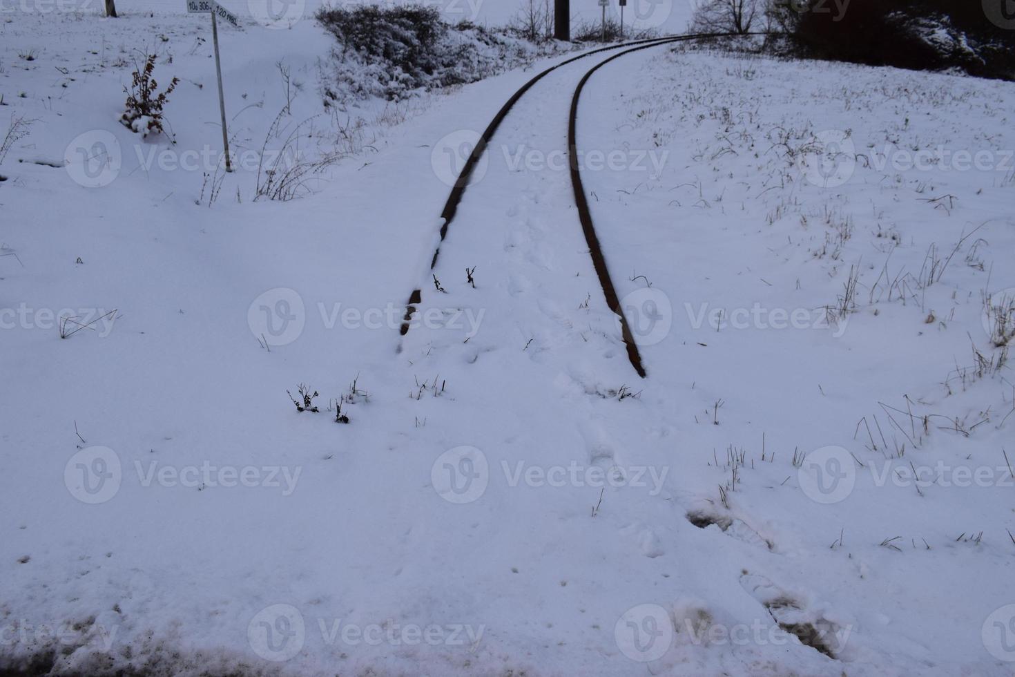 Railroad Tracks in Snow photo