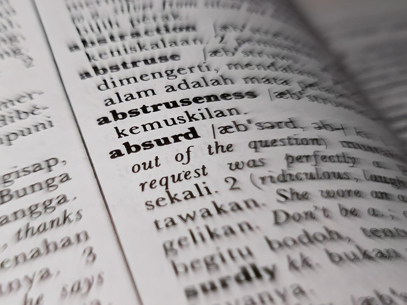 a close up of the word absurd in the English to Indonesian dictionary. For word background or wallpaper photo