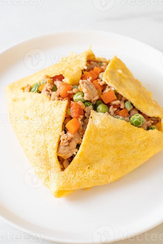 egg wrap or stuffed egg with minced pork and vegetable photo