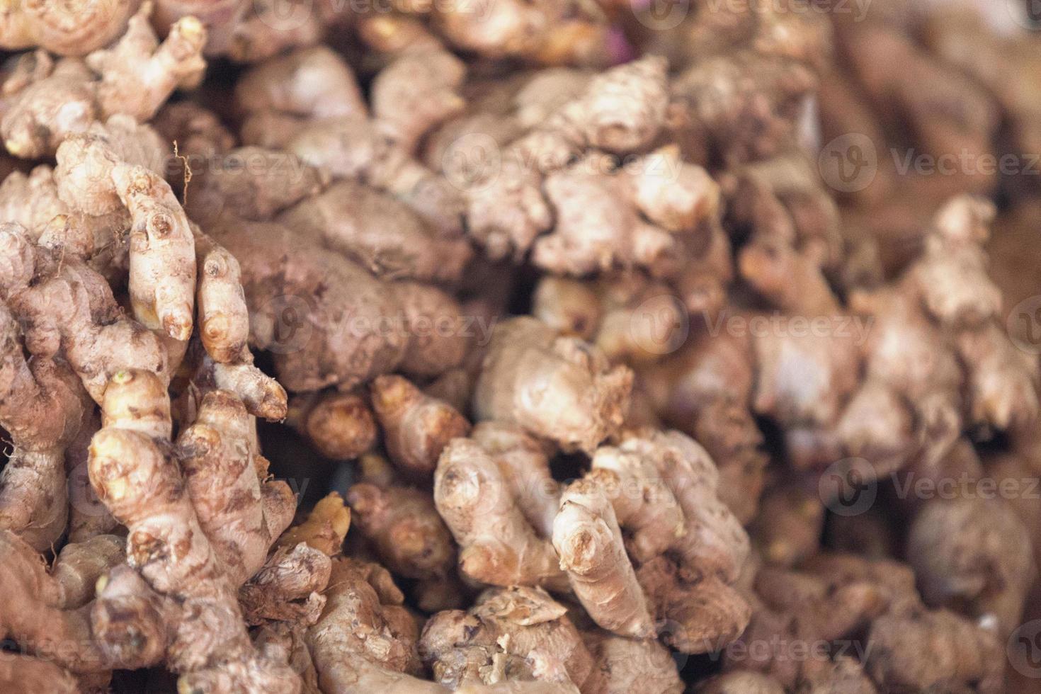 Stack of gingers on a market stall photo