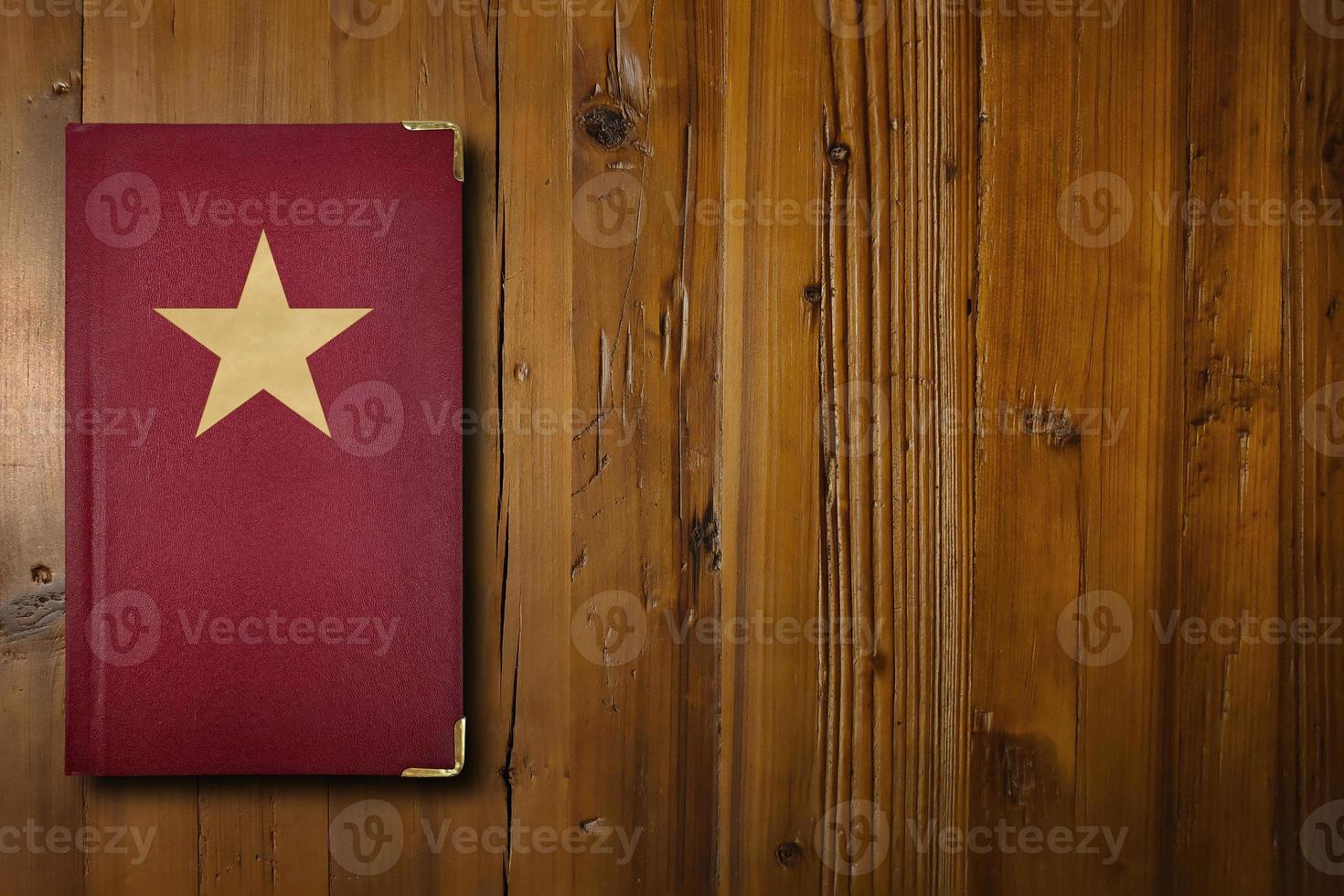 Communist book on a wooden desk photo