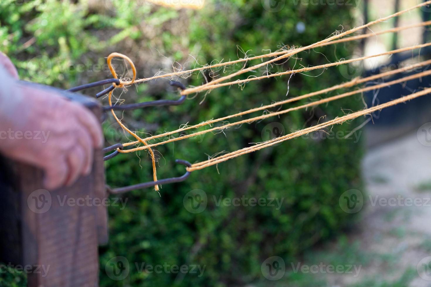 Medieval rope weaver photo