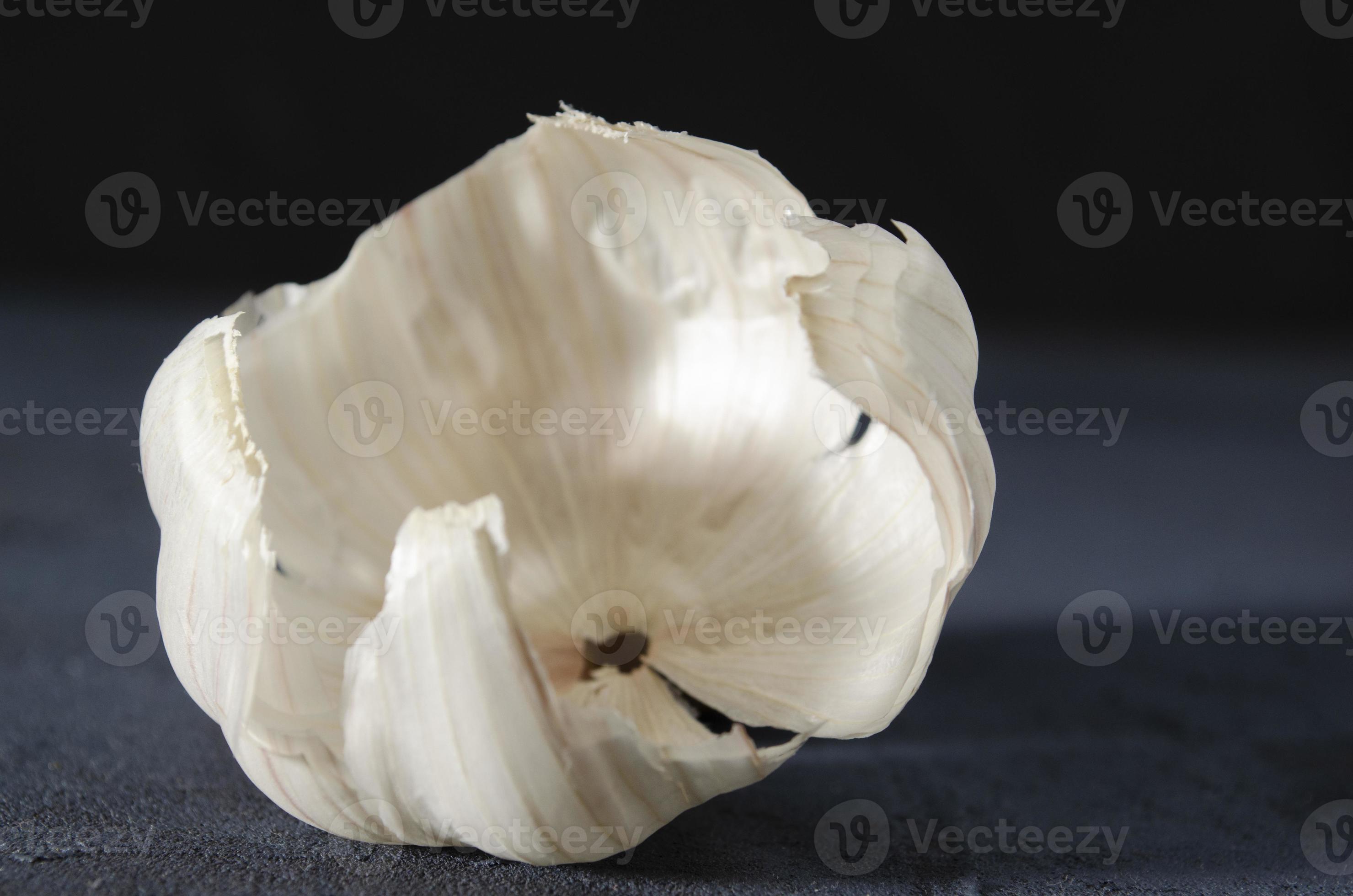 The garlic skin on the dark background. 22977965 Stock Photo at Vecteezy