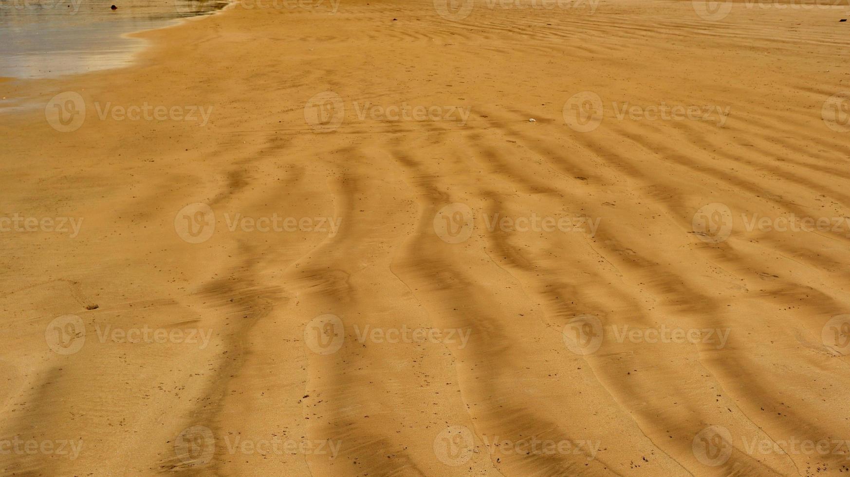 Beach sand pile with rocks for background and texture photo