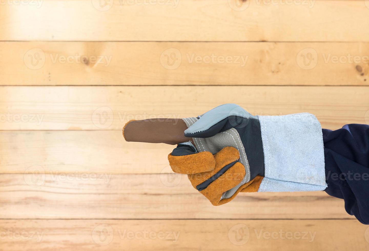 Hand in rough leather glove photo