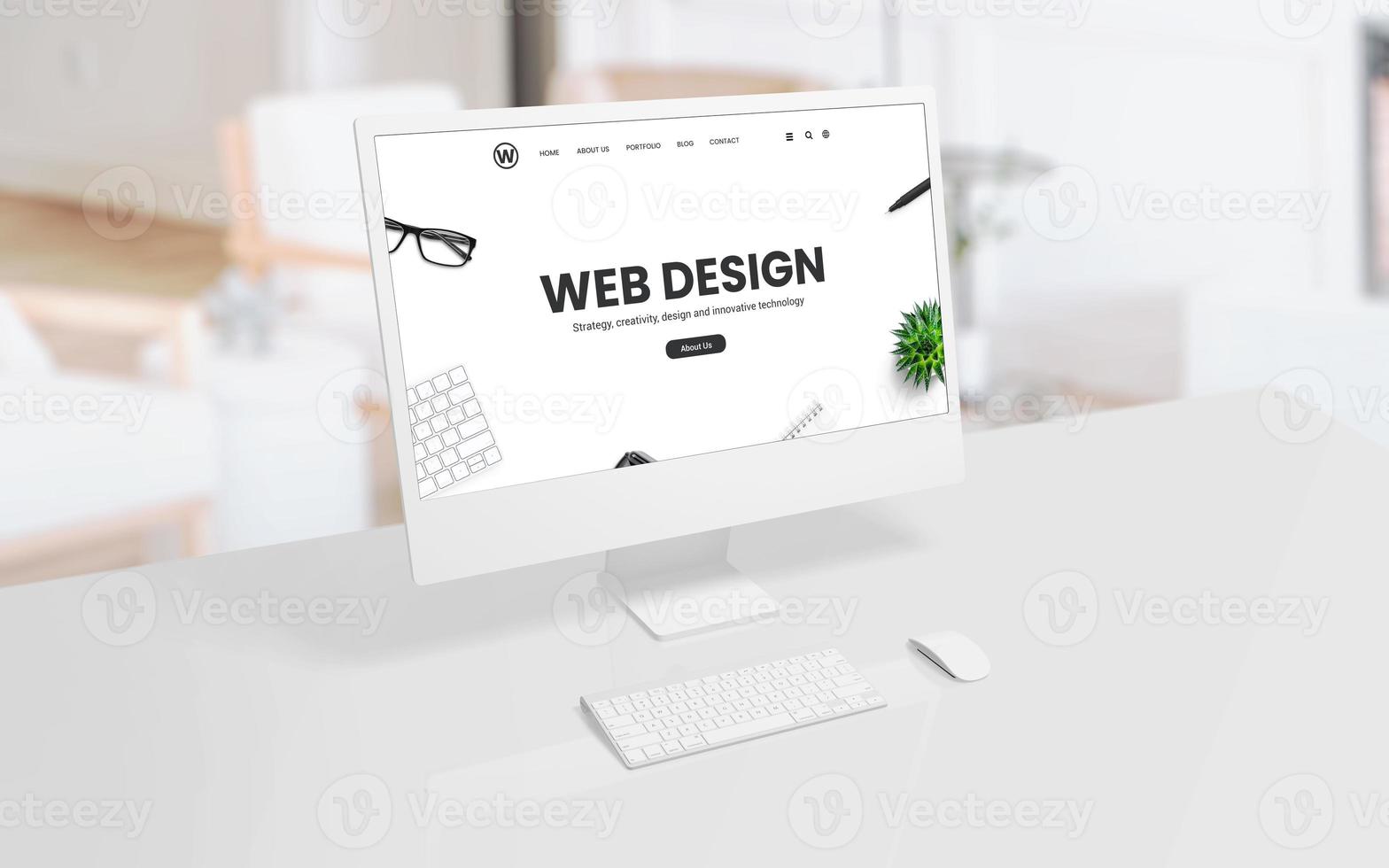 White computer display on an office or studio desk with a web design concept web page on the screen. Modern technology, creative design, and productivity concept photo