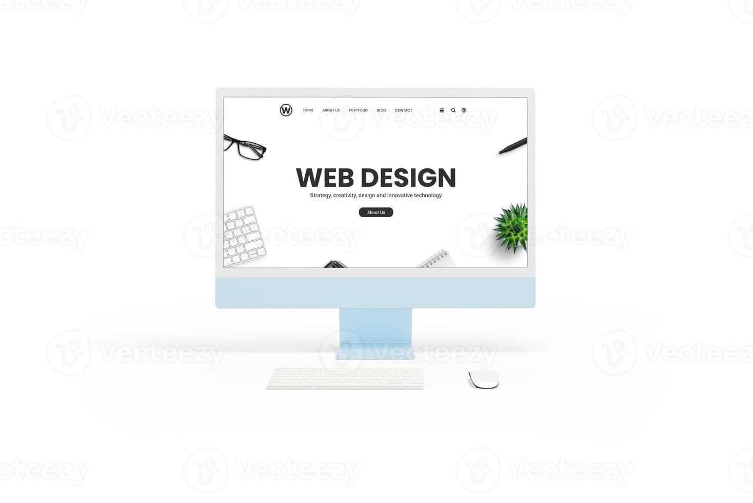 Isolated white computer display monitor with a web design studio concept page in front view. Keyboard and mouse beside. Showcasing website design concept photo