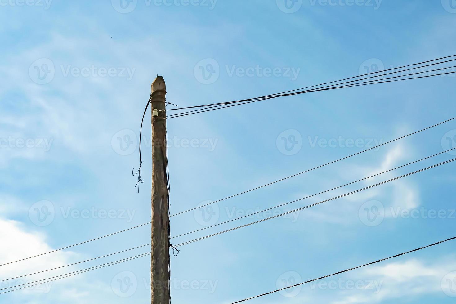 Power electric pole with line wire on colored background close up photo