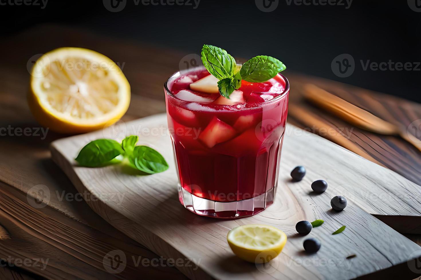 Refreshing Fruity Summer Drink on Table with Lemon and Mint photo