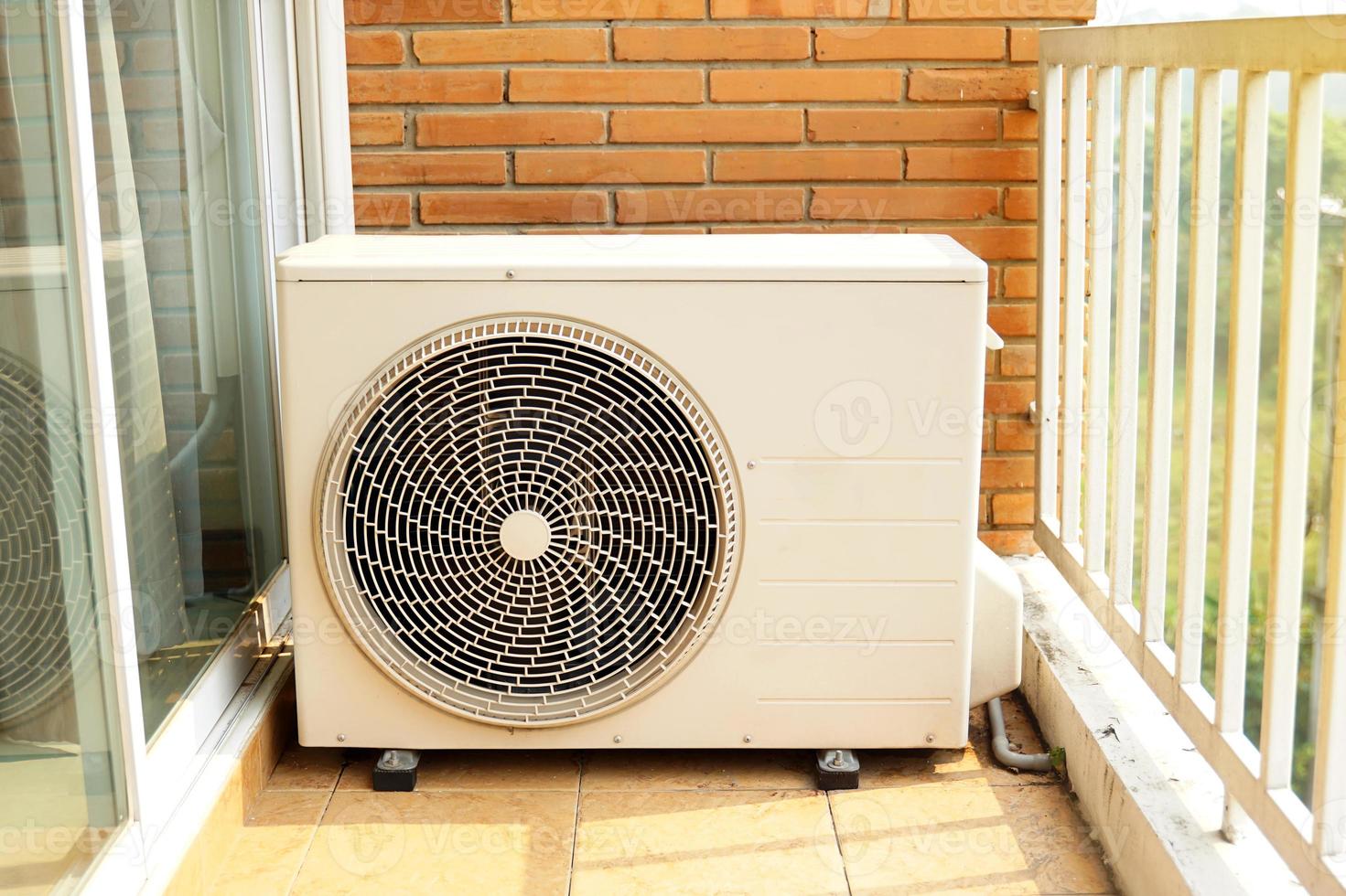 home air conditioner coil or condenser with motor installed outside the building perform cooling function. There are two types of cooling mediums, air cooled and water cooled. photo