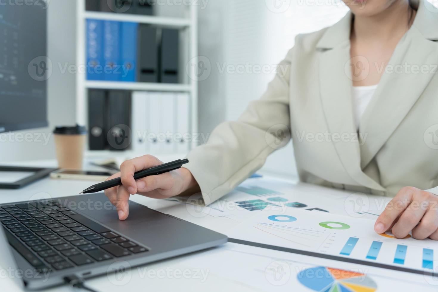 Business women calculate benefit, spreadsheets, graph financial development, bank accounts, statistics, economy, data analysis, investment analysis, stock exchange,Interest rates, income photo