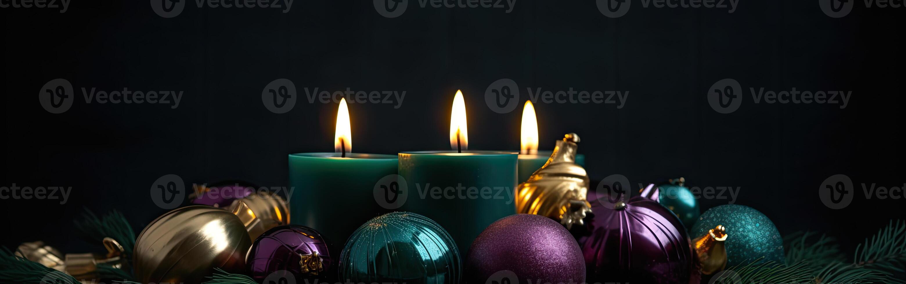 Burning candle and Christmas decoration over snow and wooden background. . photo