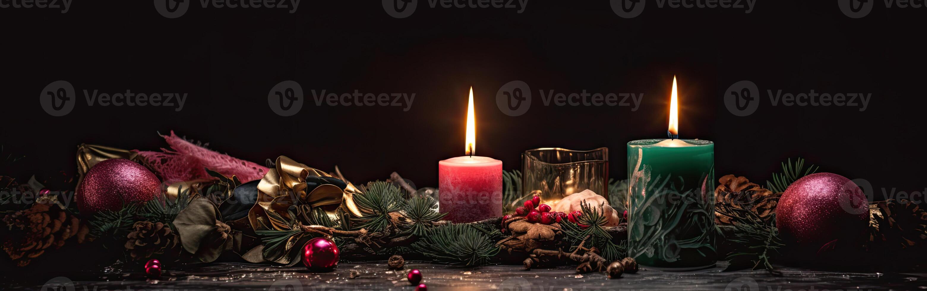 Burning candle and Christmas decoration over snow and wooden background. . photo