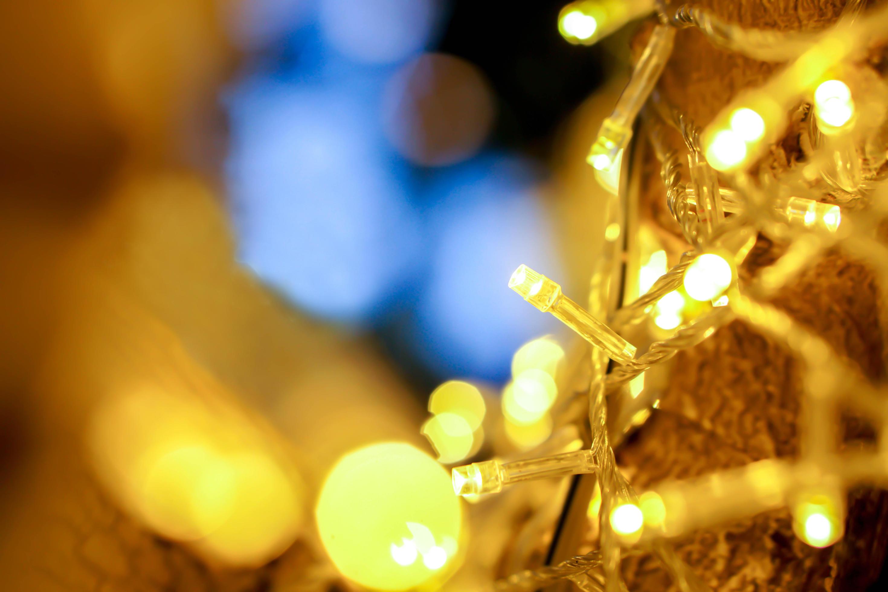 Closeup of Christmas lights and refection lighting on the tree with