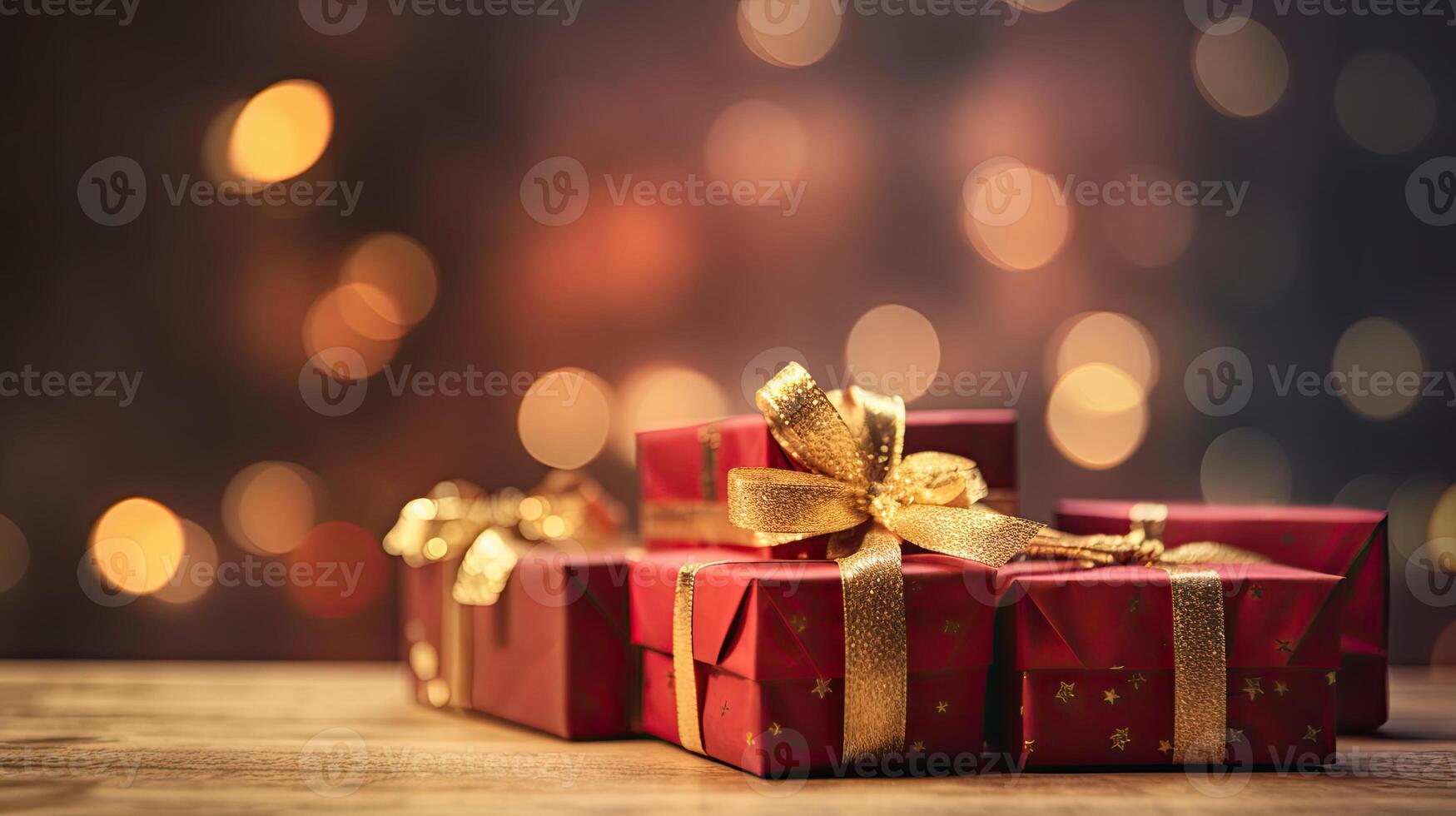 Christmas presents wrapped in red paper with gold ribbon on on wooden table background and bokeh. Place for typography and logo. Copy space. . photo