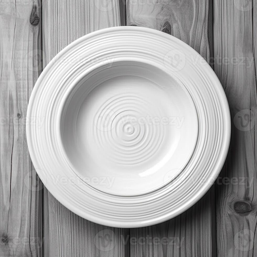 An empty plate on a white wooden table. Top view of white ceramic plate on white wooden. . photo