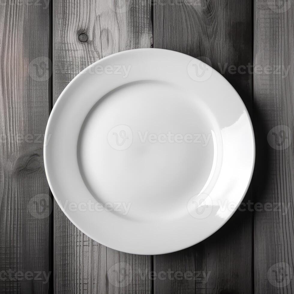 An empty plate on a white wooden table. Top view of white ceramic plate on white wooden. . photo