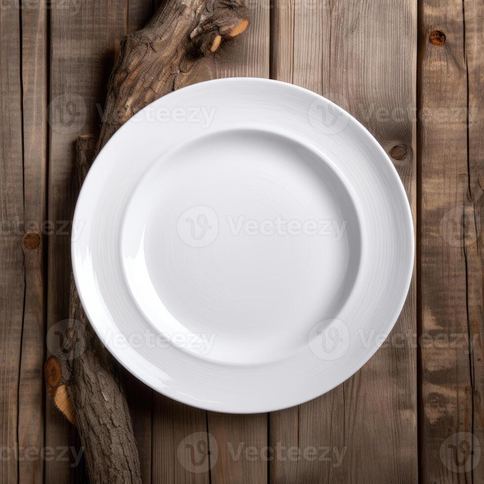 An empty plate on a white wooden table. Top view of white ceramic plate on white wooden. . photo