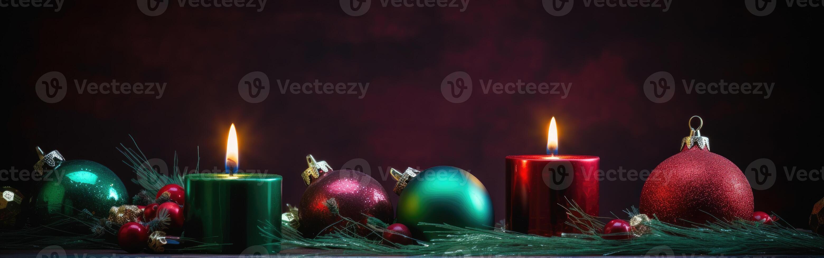 Burning candle and Christmas decoration over snow and wooden background. . photo