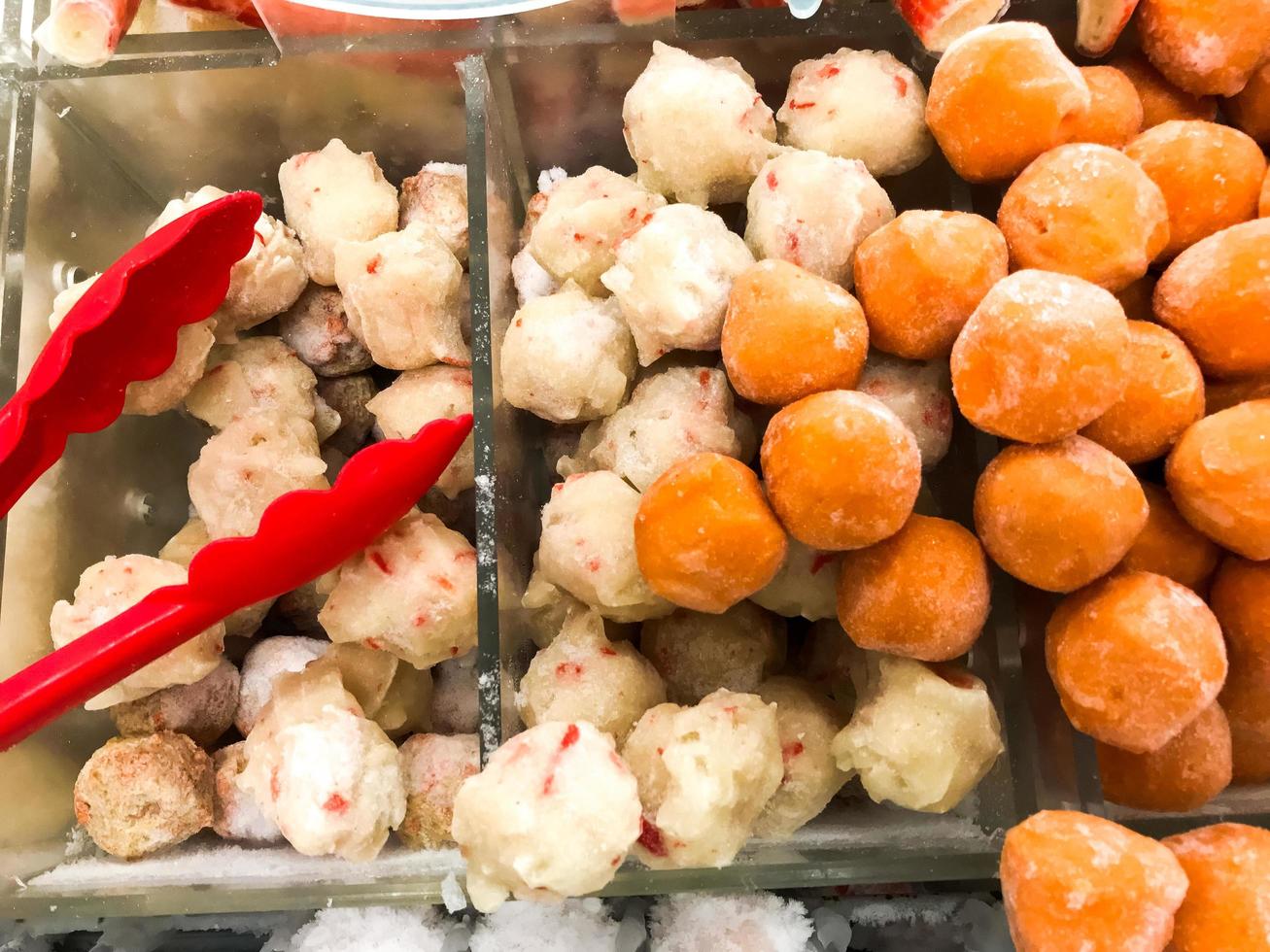 fresh raw meatballs and chicken nugget ready to be cooked photo