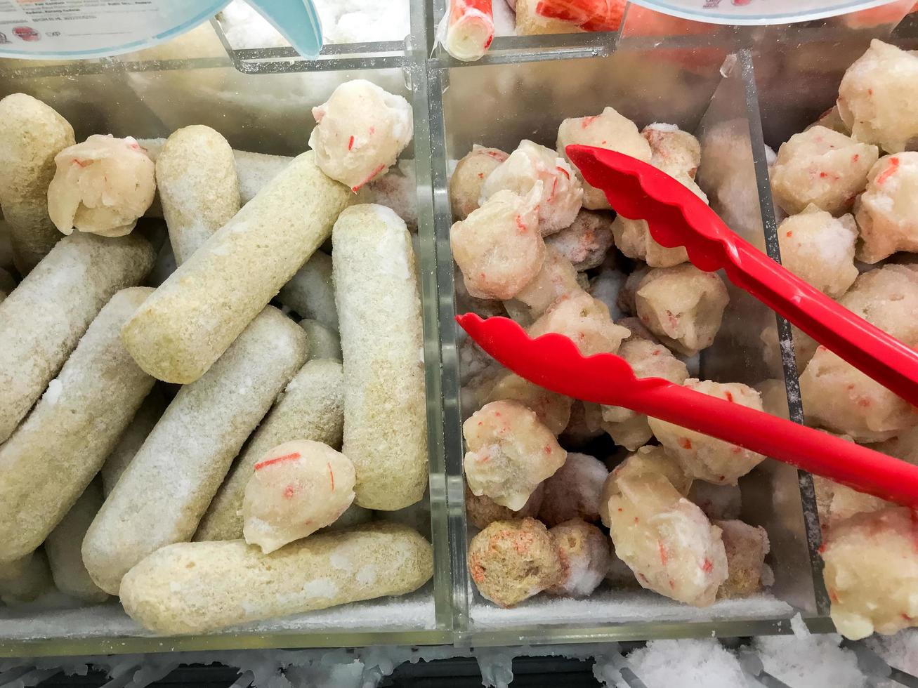 fresh raw meatballs and chicken nugget ready to be cooked photo