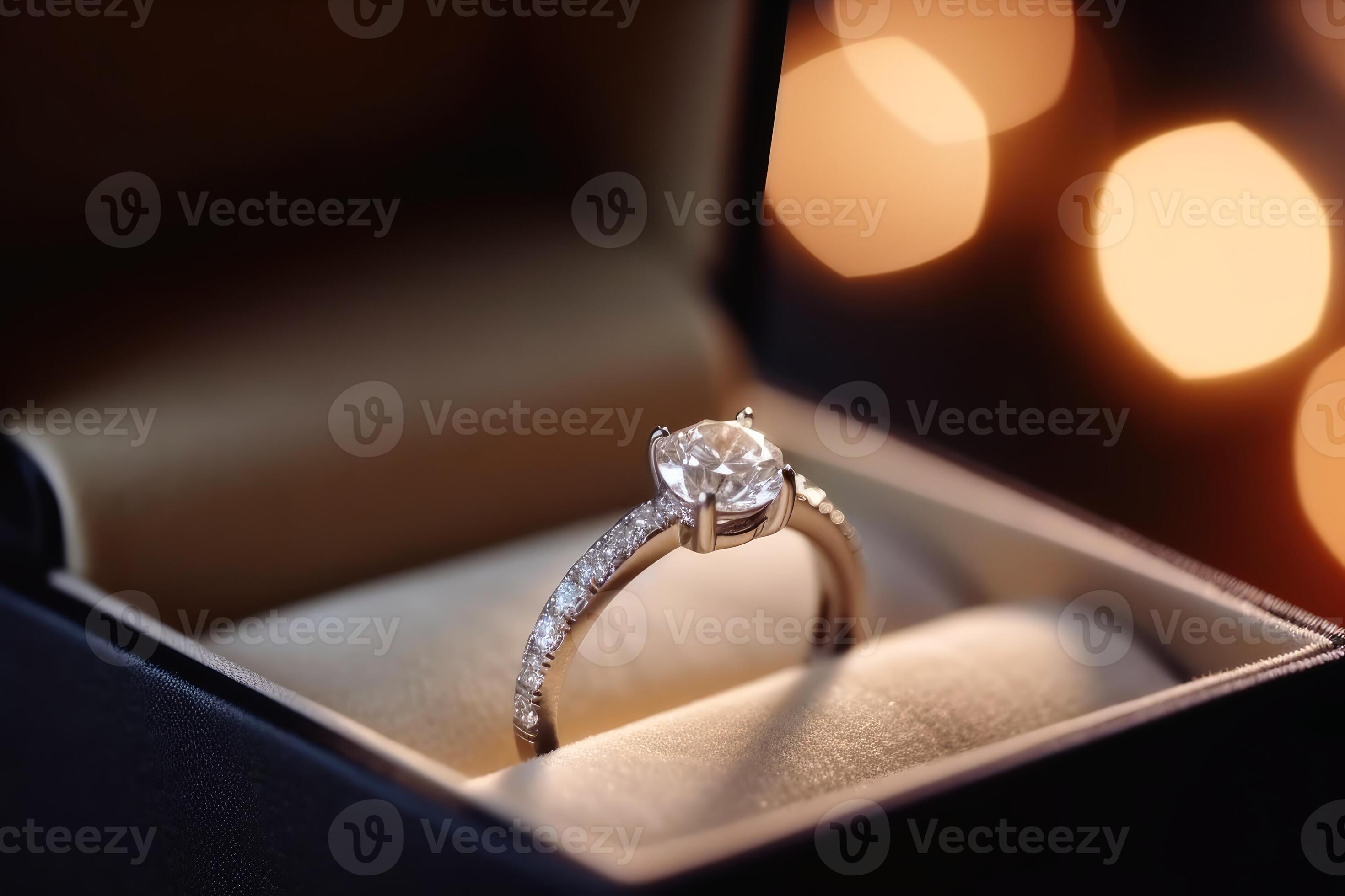 A beautiful wedding ring in the box with sparkling light created with