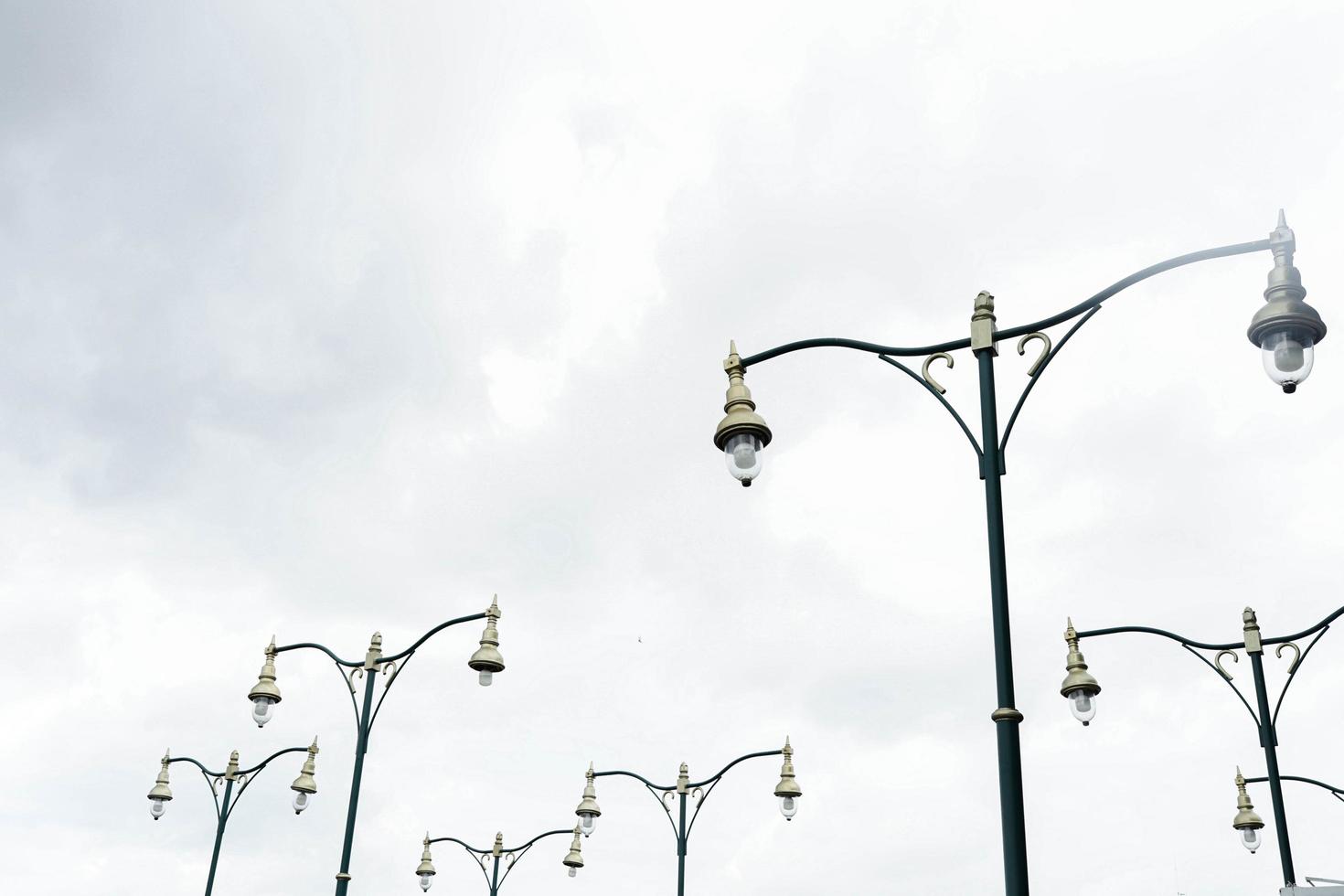 City lights by the road lined up under the sky photo