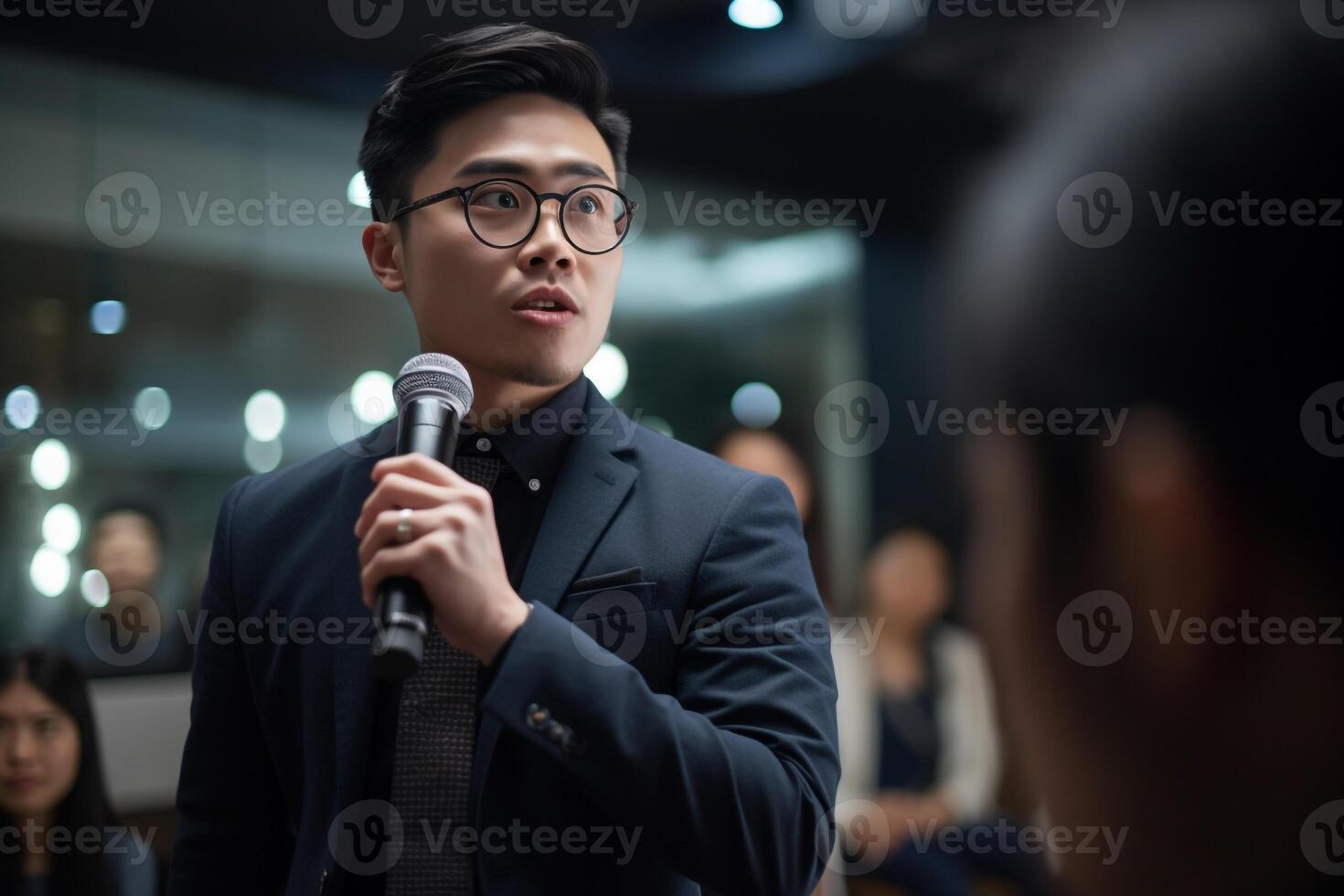 A man holding mic public speaking in front of the audience. realism created with AI tools photo