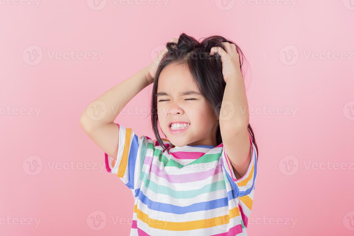 Image of Asian child posing on Pink background photo