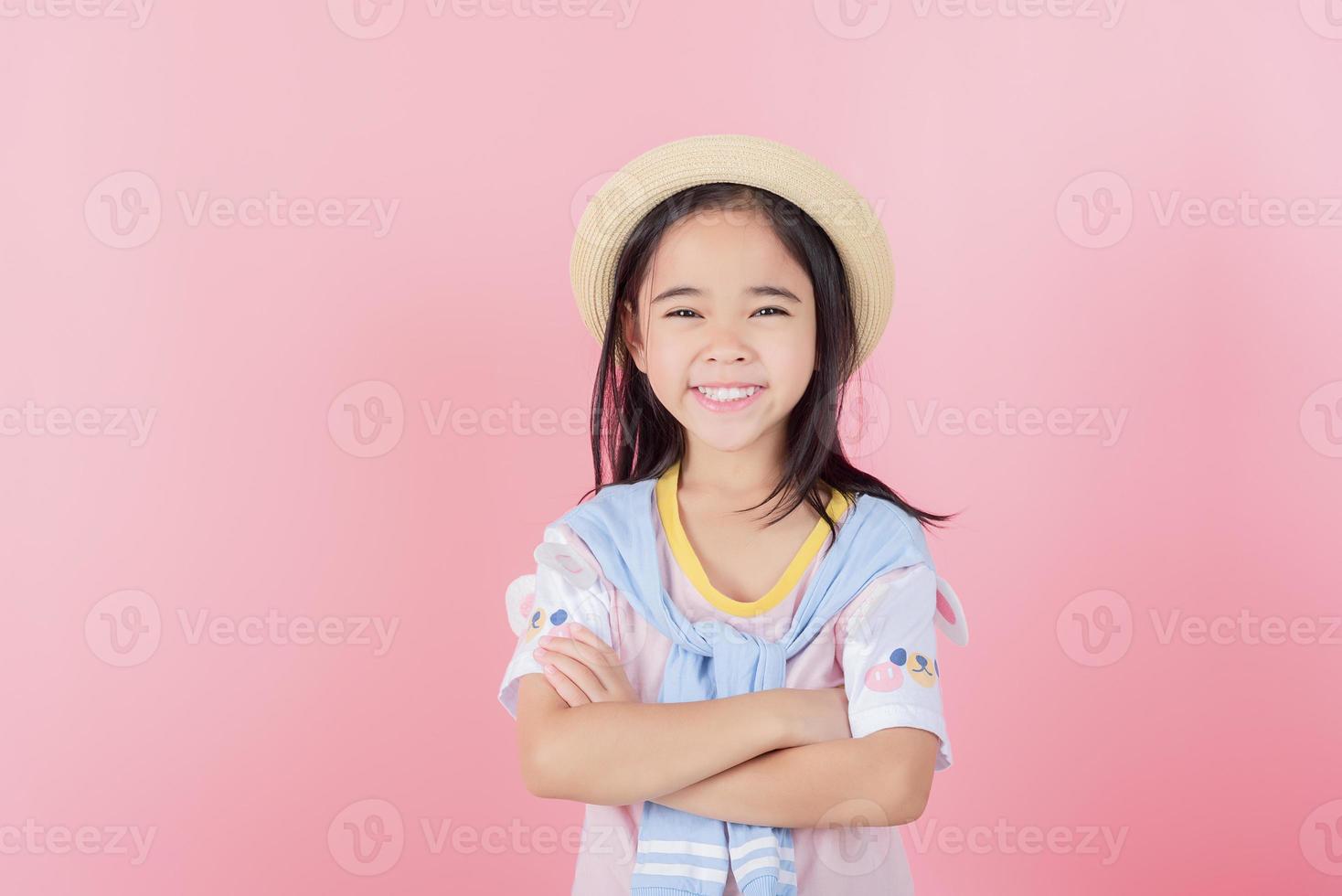 Image of Asian child posing on Pink background photo